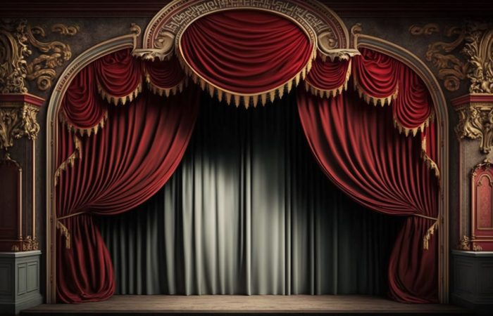 red curtains of an old stage which are closed