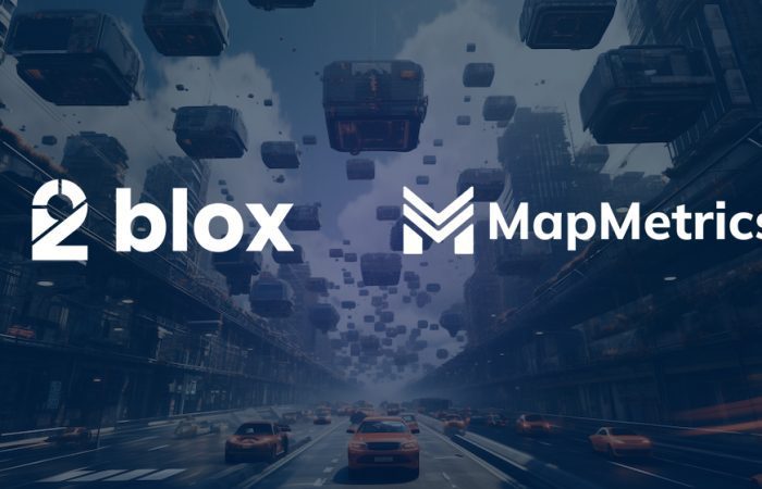 Cars cruising on a highway with digital 'blox' floating overhead, flanked by the 2blox and MapMetrics logos, symbolizing their innovative collaboration in the crypto domain.
