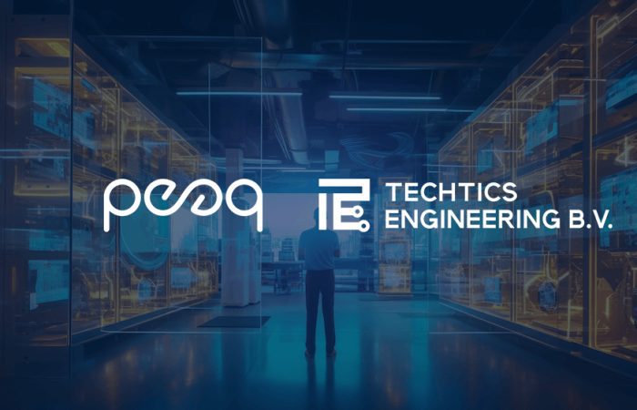 A man stands in front of a sophisticated hardware setup, proudly representing the collaboration between peaq and MapMetrics to advance DePIN hardware development.