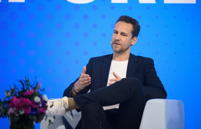 MapMetrics CEO speaking as a panelist at TOKEN2049, highlighting the company's role in DePIN.